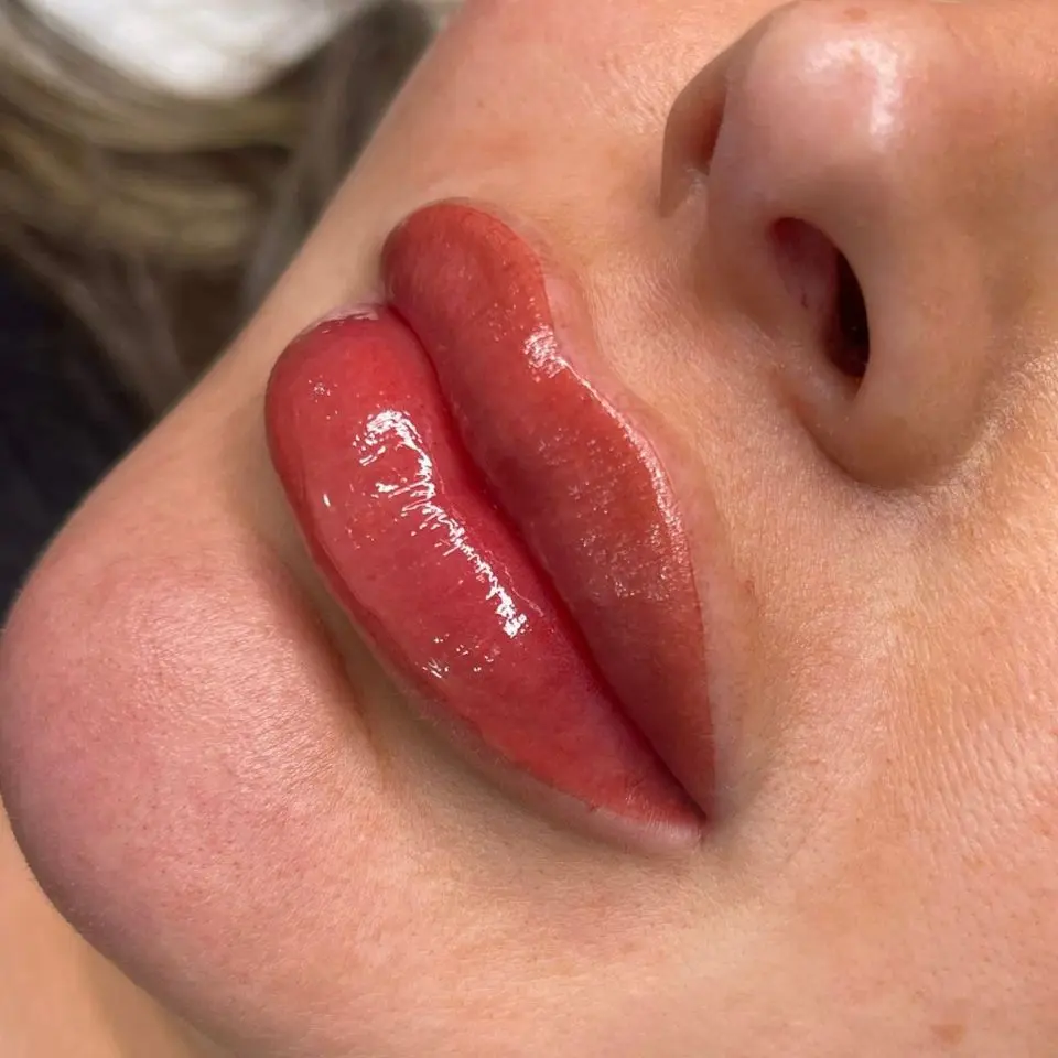 A customer after having her permanent lip blush applied