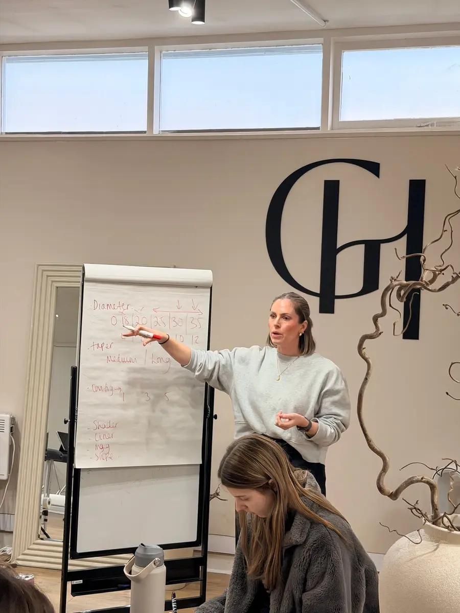 Gemma Henderson teaching theory at the whiteboard in the Newton Abbot training academy